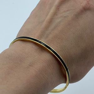 Gold and black bangle